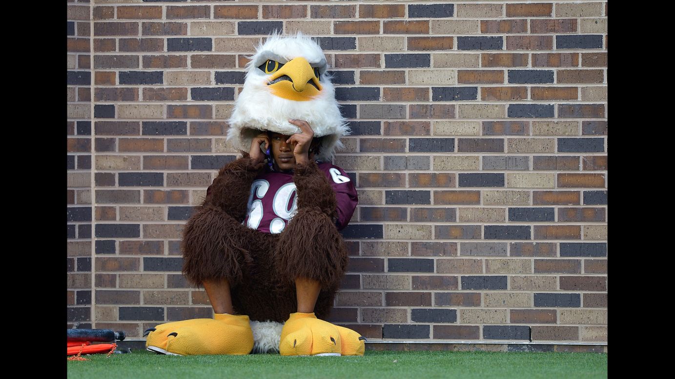 The mascot of the North Carolina Central Eagles takes a phone call during a football game against Duke in Durham, North Carolina, on Saturday, September 3.