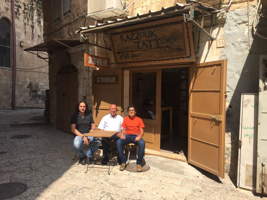 Three generations of Razzouks outside their shop