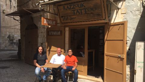 Three generations of Razzouks outside their shop