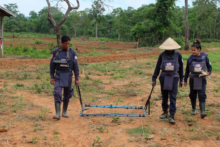 The HALO Trust is the world's largest humanitarian mine clearance organization. It works in Laos to clear unexploded ordnance. Here, two HALO technicians use a Large Loop Detector to clear a hazardous area. 