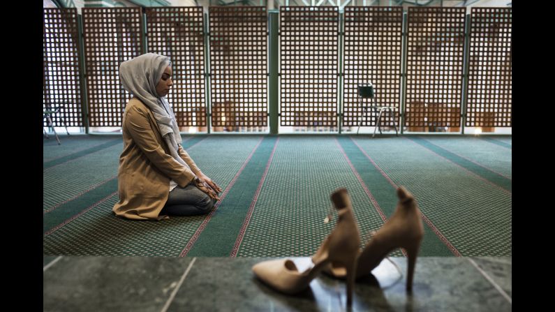 Moufid prays in a Stockholm mosque.