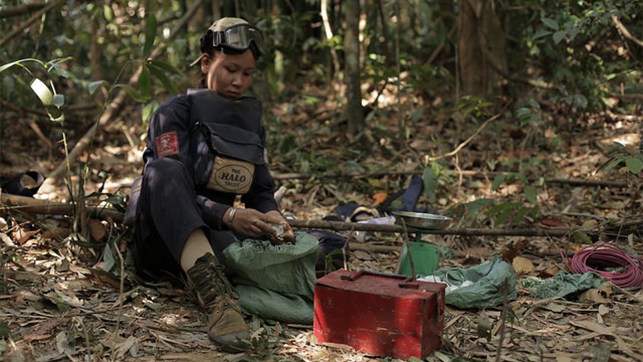 Ms Toyota, one of HALO's team leaders, prepares what she needs to conduct the demolition of a cluster munitions. 