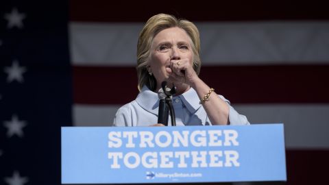 Democratic presidential nominee Hillary Clinton coughs during a Labor Day rally in Cleveland.