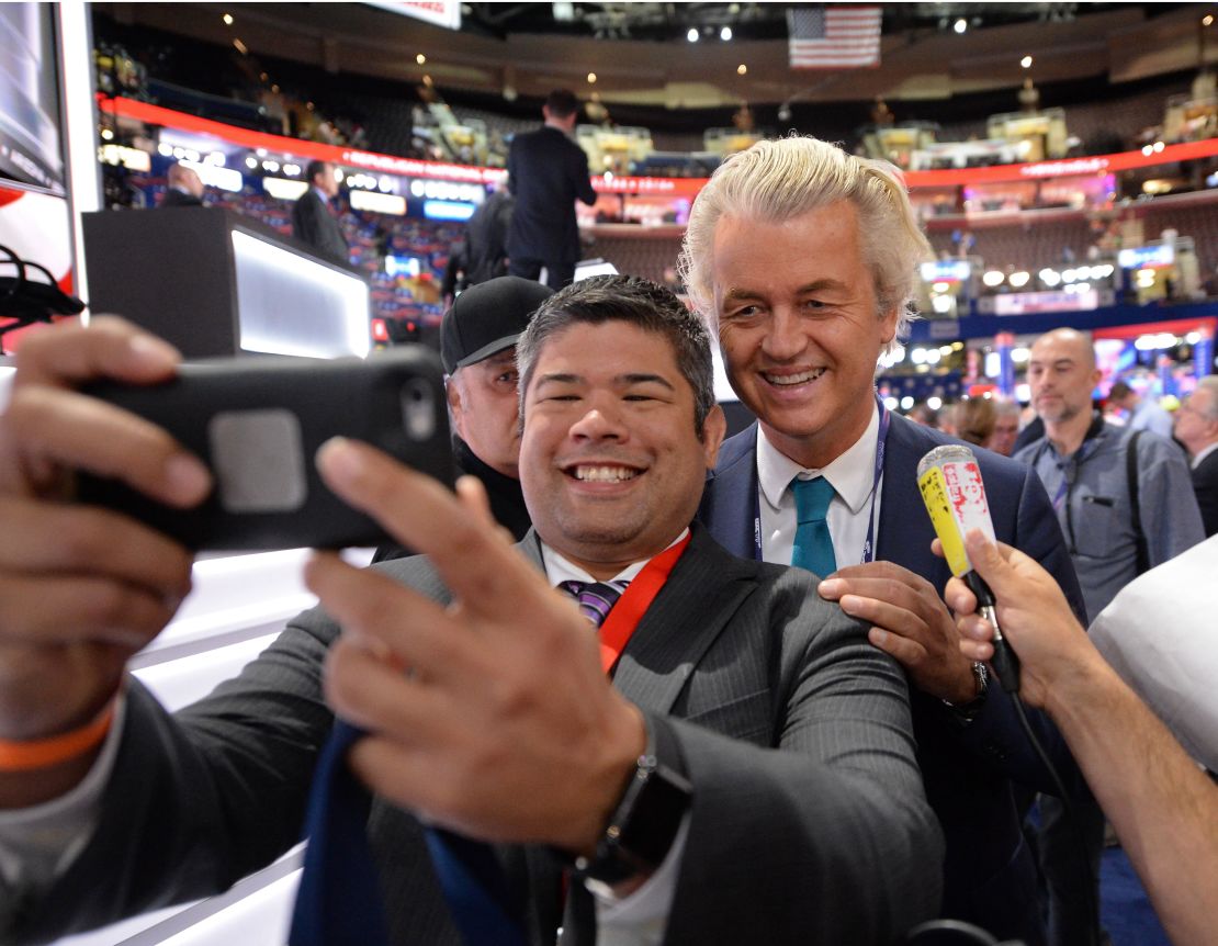 Dutch politician Geert Wilders, right, poses  with delegates at the  Republican convention in Cleveland, Ohio, in August.