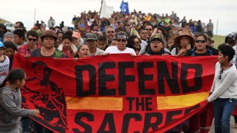 Native Americans march to a burial ground site they say was disturbed by bulldozers building the Dakota Access Pipeline. 