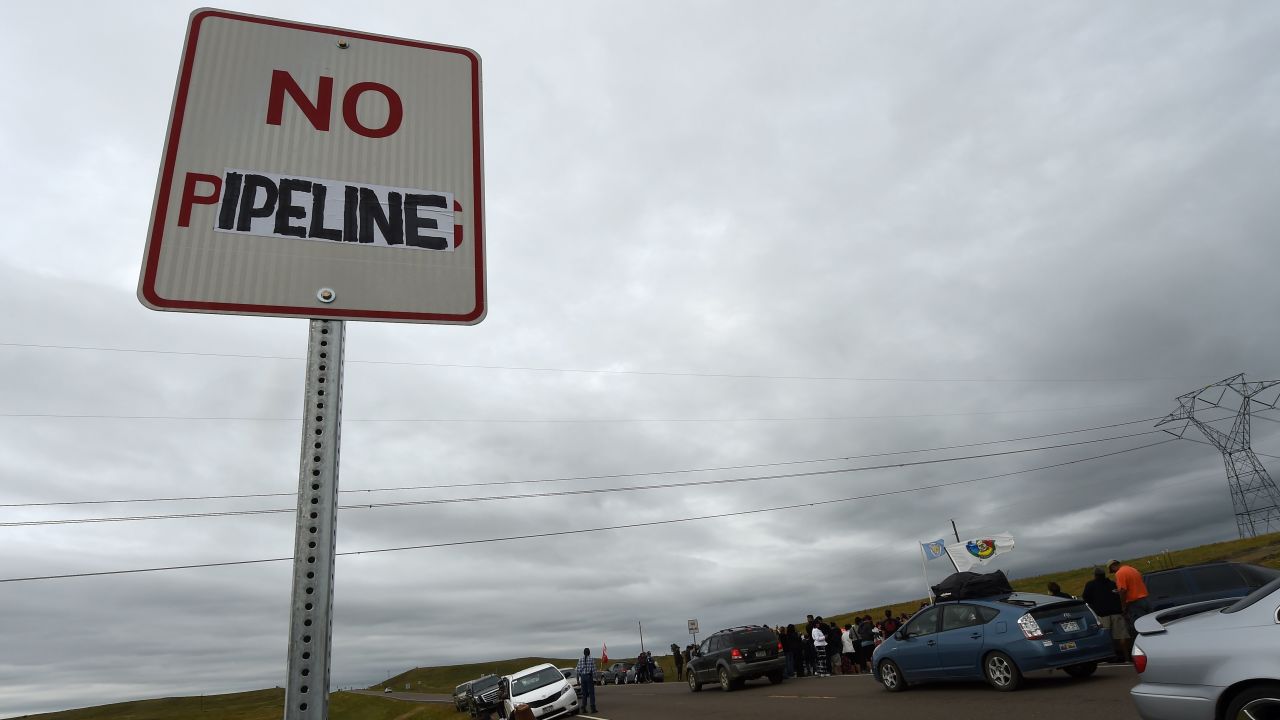 A modified highway sign reads "No Pipeline" near the site of a protest against the Dakota Access Pipeline.