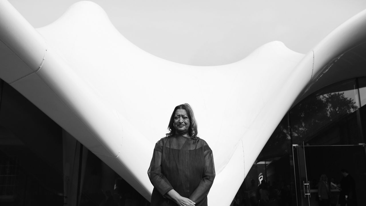 The late architect Zaha Hadid poses in front of the redeveloped Serpentine Sackler Gallery in Hyde Park in London