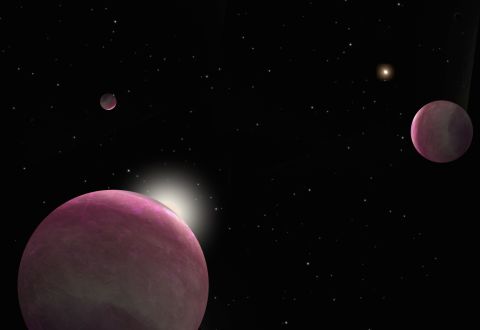 Artist's conception of the binary system with three giant planets discovered, where one star hosts two planets and the other hosts the third. The system represents the smallest-separation binary in which both stars host planets that has ever been observed.