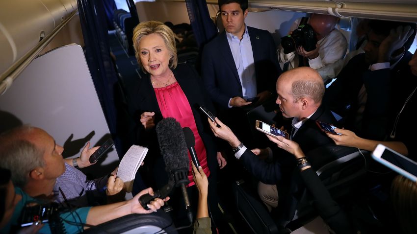 Hillary Clinton speaks to members of the media aboard her campaign plane on September 6, 2016 while in flight from White Plains, New York.