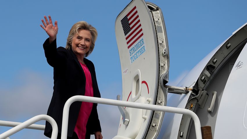 Democratic presidential nominee former Secretary of State Hillary Clinton waves as she boards her campaign plane at Westchester County Airport on September 6, 2016 in White Plains, New York. Clinton will be campaigning in Florida.  (Photo by Justin Sullivan/Getty Images)