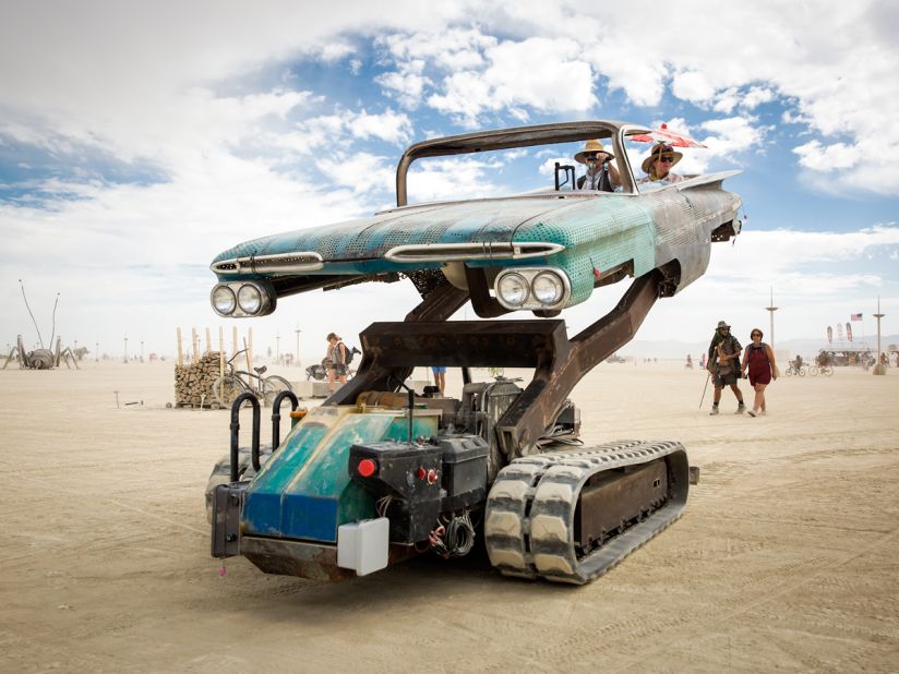 "Artist Bruce Tomb created this startling mutant vehicle by mating an excavator to an old El Camino and joining them by<br />an armature lifting passengers high off the ground and tilting them at odd angles."