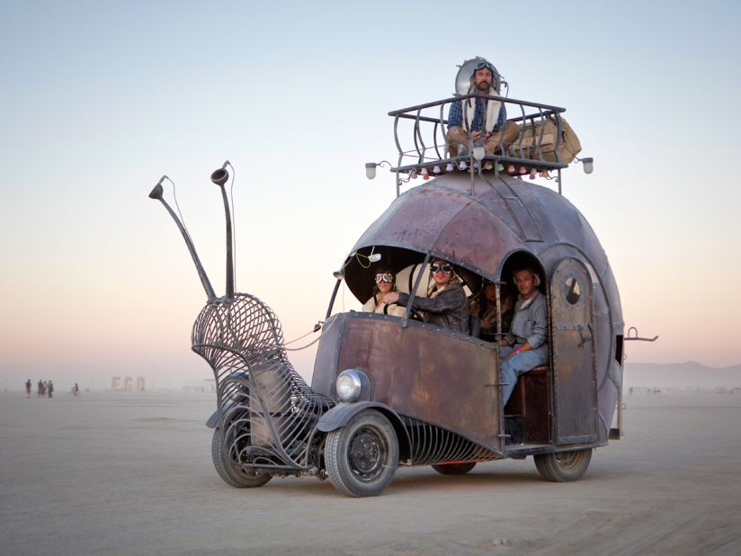 "Artists Jon Sarriugarte and Kyrsten Mate built this snail-shaped art car on top of a 1966 VW Beetle floor pan with scales made of galvanized scrap metal. It can hold up to 19 people, most of them inside but a few on top of the shell on a special viewing platform."