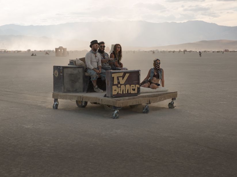 "Some mutant vehicles are little more than modified golf carts, like this concept car consisting of a platform and a couch ferrying a few friends across the playa at Burning Man 2016."