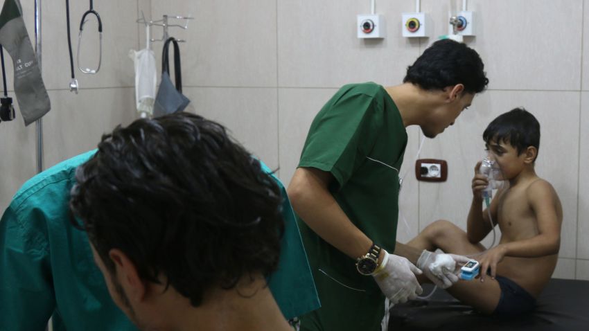 Doctors treat Syrians suffering from breathing difficulties at a make-shift hospital in Aleppo after regime helicopters dropped barrel bombs on the rebel-held Sukkari neighbourhood of the northern Syrian city on September 6, 2016. 
The Britain-based Syrian Observatory for Human Rights said the bombs hit the Sukkari neighbourhood and that more than 70 people "most of them civilians" were treated for choking symptoms.  / AFP / THAER MOHAMMED        (Photo credit should read THAER MOHAMMED/AFP/Getty Images)