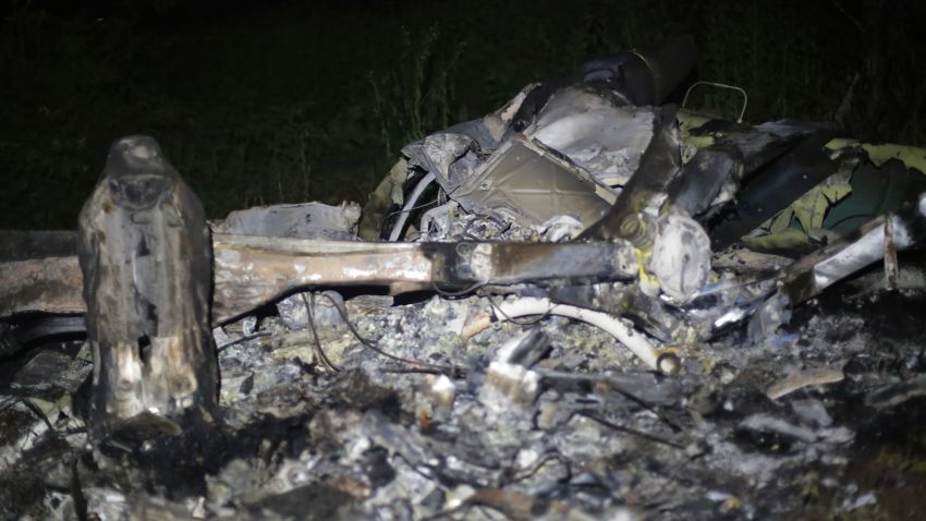 Picture of the wreckage of a helicopter that was involved in a police operation and was allegedly shot down by drug traffickers, taken late on September 6, 2016 in La Huacana, Michoacan State, Mexico.
A police helicopter crashed Tuesday during an operation to capture suspected gang leaders in western Mexico, and authorities were investigating whether gunmen shot it down, killing three officers and the pilot. / AFP / ENRIQUE CASTRO        (Photo credit should read ENRIQUE CASTRO/AFP/Getty Images)