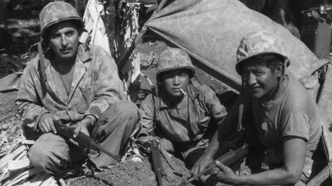 Cpl. Oscar Ithma, Pfc. Jack Nez, and Pfc Carl Gorman,  left to right, Navajos with the Marines in WWII.
