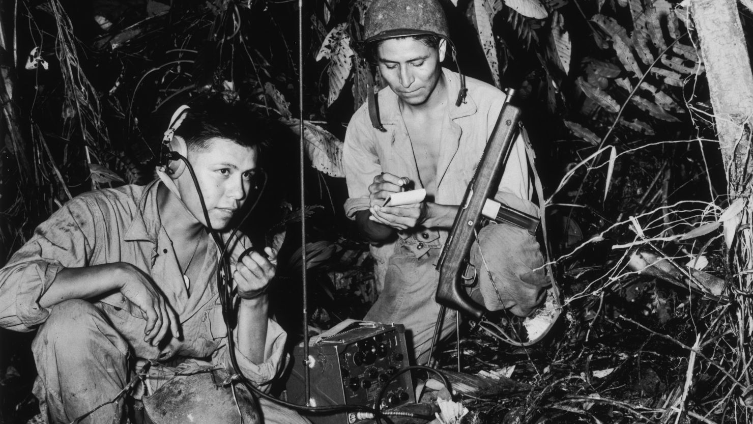 The Navajo Code Talkers shown here were Cpl. Henry Bake, Jr. and PFC George H. Kirk, as they worked in Bougainville, in the South Pacific, circa 1943.