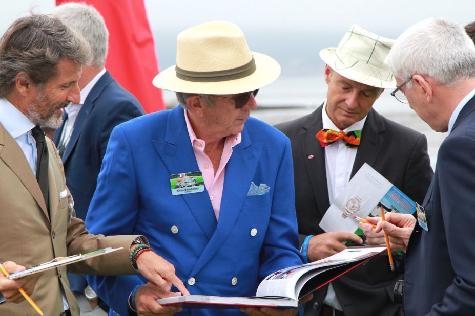 The look for car collectors and judges at the Concours is decidedly dapper, with most sporting some version of the straw Panama. The man in the colorful bowtie is Bugatti design director Achim Anscheidt.