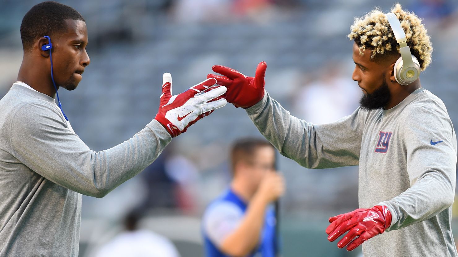 Wide receivers Victor Cruz (L) and Odell Beckham of the New York Giants engaged in a choreographed pregame handshake, one of many rituals which NFL players will embrace throughout the season.
