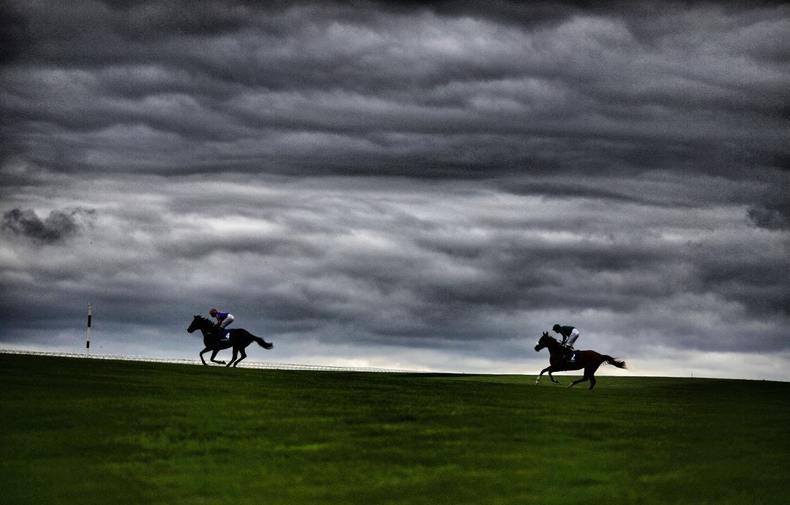 Runners make their way across the centre of the track at Curragh Racecourse.