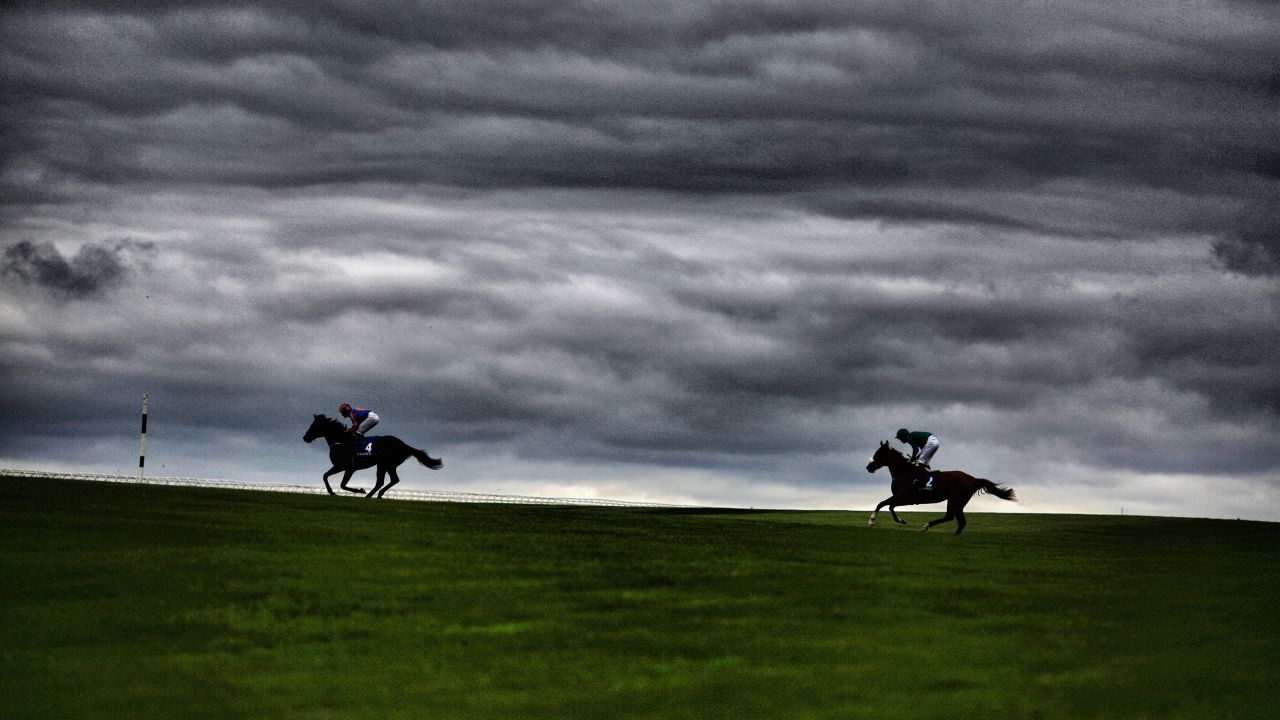 Runners make their way across the centre of the track at Curragh Racecourse.