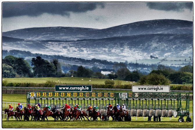 The magical backdrop to the Curragh is seen as jockeys ready themselves for the off at a race in May 2015.