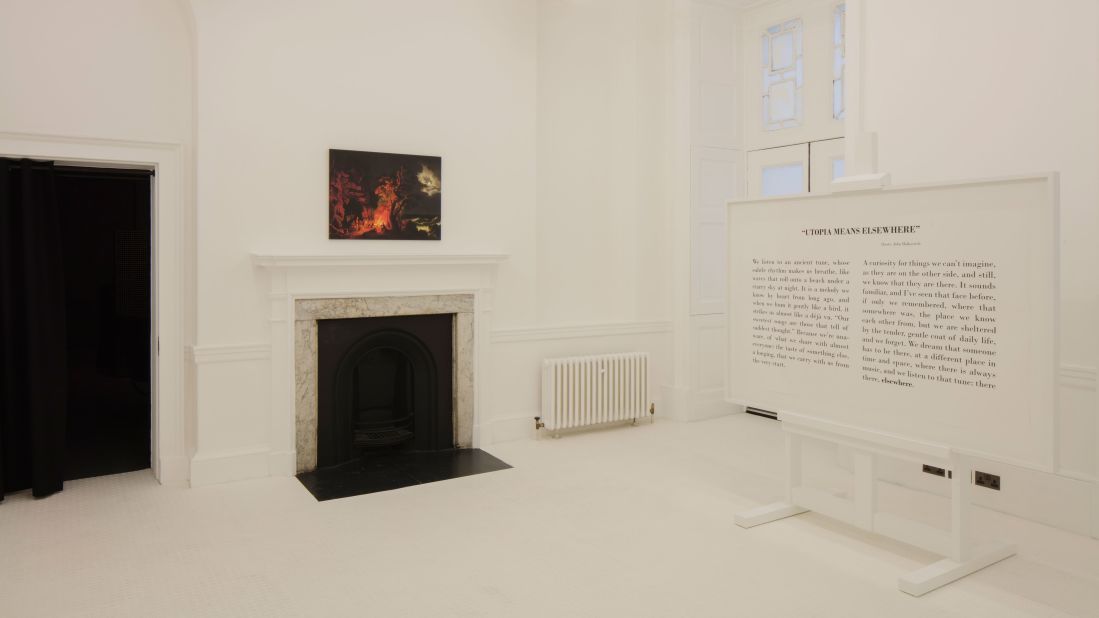 Germany's installation by designers Konstantin Gric and Olivia Herms, takes the shape of two opposing rooms: the first is a simply outfitted, bright white space showcasing the John Malchovich quote "Utopia means elsewhere".<br />