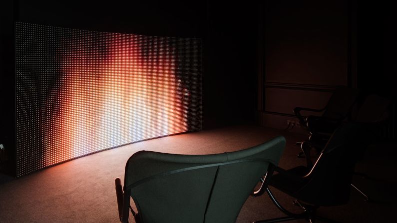 The second part of Germany's entry is a black-box room with a digital fireplace and comfy seating, encouraging visitors to sit back and reflect on their personal interpretation of utopia. <br />