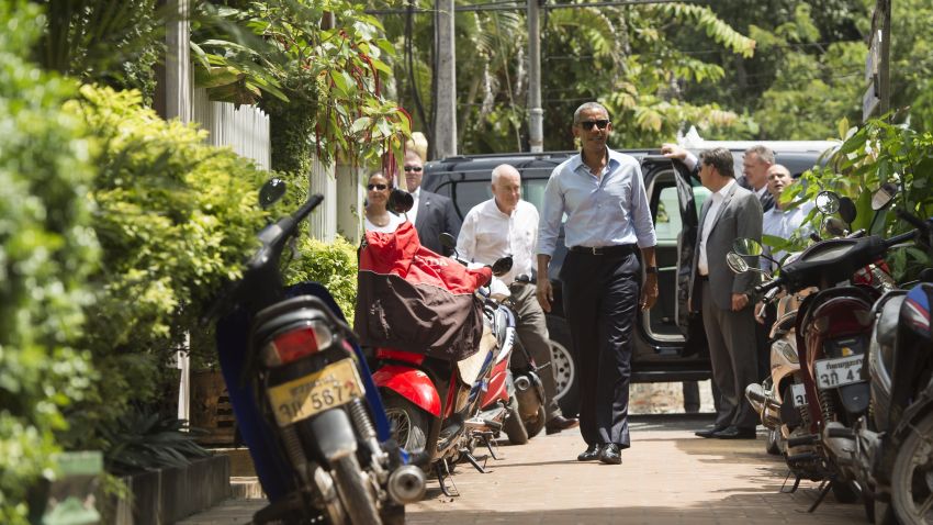 US President Barack Obama walks to shop for gifts in Luang Prabang on September 7, 2016.