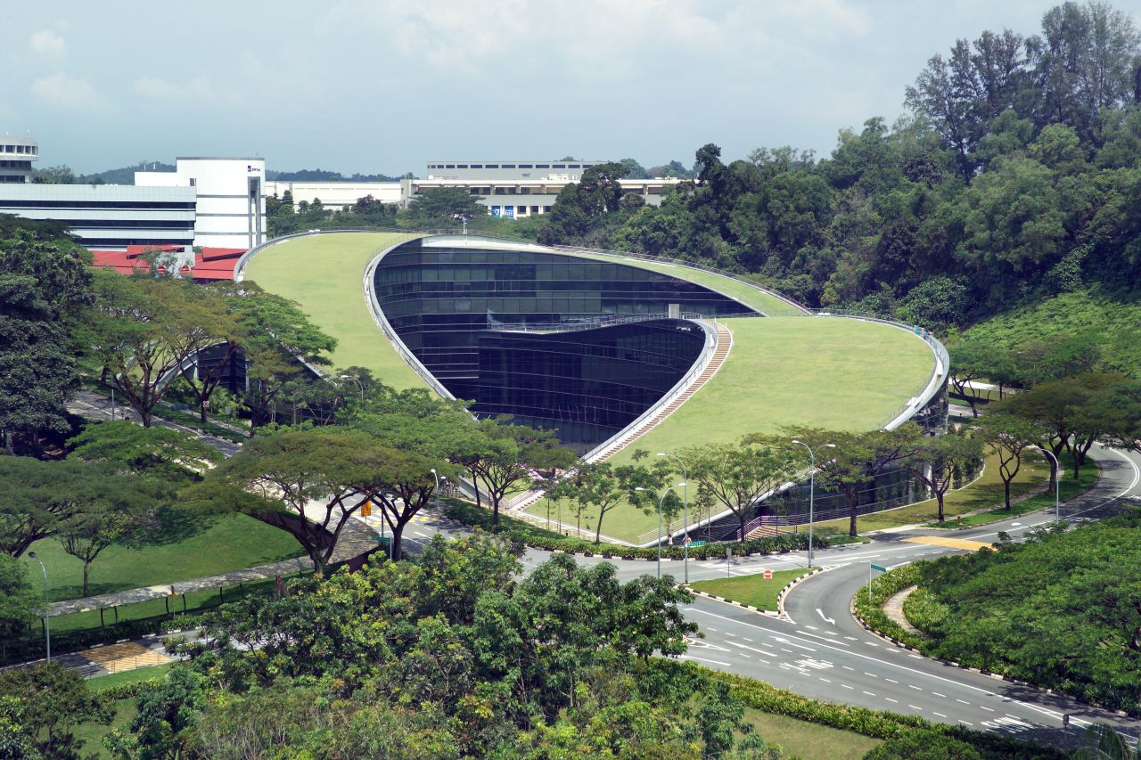 The incredible curved green roof of this art and design school in Singapore serves as an informal gathering space and sits atop a five-story facility that features classrooms and studios. 