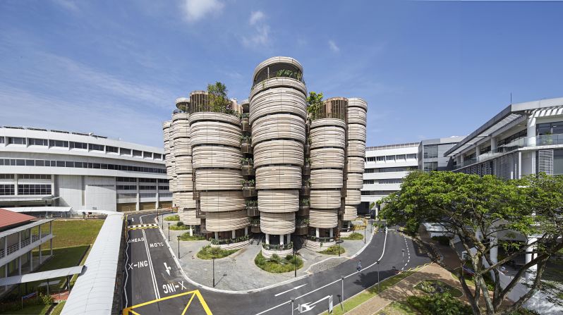 Structures that eschew glass facades, such as this building at Singapore's Nanyang Technological University, may enjoy lower energy bills, as their solid surfaces trap heat in winter and keep out sunlight in the summer.