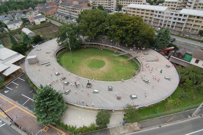 Located just outside Tokyo, the architects of this magical school turned its roof into an endless playground and designed the building around existing trees, that now grow right through the middle of its classrooms. 