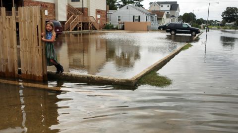 Chloe Riffle, 7, looks on as she is surrounded by floodwater in Norfolk, Virginia, on Sunday, September 4. Labor Day plans for many residents living in coastal regions throughout the Northeast were affected<a href="http://www.cnn.com/2016/09/03/us/tropical-storm-hermine/" target="_blank"> by heavy rain and winds from storm Hermine.</a>