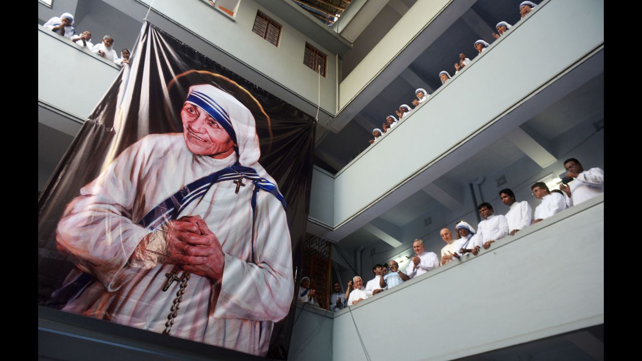 Roman Catholic nuns of the Missionaries of Charity look on after a service for the late Mother Teresa in Kolkata, India, on Monday, September 5. Mother Teresa, who devoted her life to helping the poor and ill in India, was <a href="http://www.cnn.com/2016/09/04/europe/mother-teresa-canonization/" target="_blank">declared a saint by Pope Francis</a> in a canonization mass at the Vatican on Sunday, September 4.