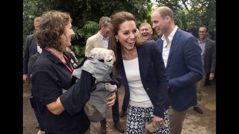 Catherine, Duchess of Cambridge, and Prince William are greeted by a baby dinosaur puppet upon their arrival at the Eden Project in Cornwall, England, on Friday, September 2.