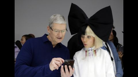 Apple CEO Tim Cook, left, shows an iPhone 7 to performer Maddie Ziegler during the company's annual press event in San Francisco on Wednesday, September 7. <a href="http://money.cnn.com/2016/09/07/technology/apple-iphone-7-launch/" target="_blank">Apple unveiled</a> the new iPhone 7 smartphone and a new, waterproof Apple Watch, among other products.