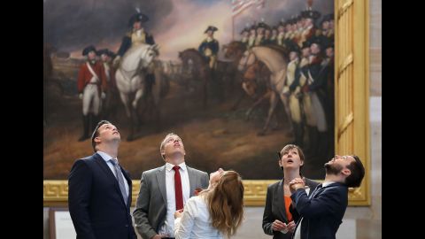 People look at the ceiling of the newly restored rotunda inside the US Capitol in Washington on Tuesday, September 6.