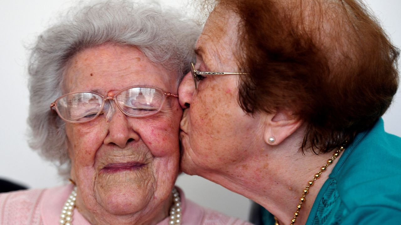 Eighty-five-year-old Yvette Florens, right, kisses her 113-year-old mother, Honorine Rondello, at a retirement home in Saint-Maximin-la-Sainte-Baume, France, on Wednesday, September 7. Born in Paimpol, France, on July 28, 1903, Rondello is now the oldest person in France.