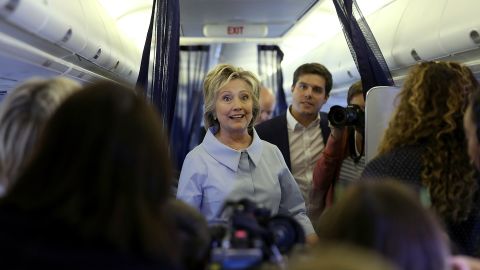 Democratic presidential nominee Hillary Clinton talks with reporters aboard her new campaign plane at Westchester County Airport in White Plains, New York, on Monday, September 5.