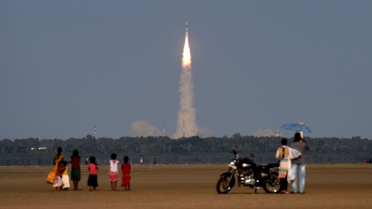 People watch as an Indian Space Research Organization satellite launches from Sriharikota, India, on Thursday, September 8.