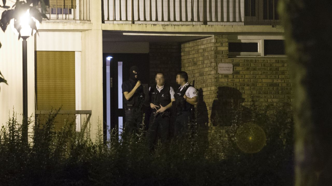 Police appear outside a building Thursday in Boussy-Saint-Antoine after the arrest of female suspects.