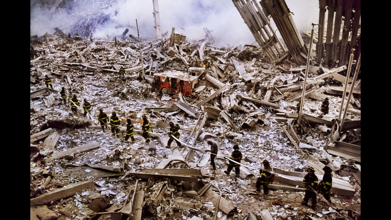 Steve McCurry captures a procession of firefighters entering ground zero.