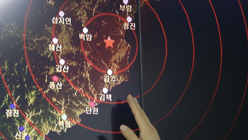 An official of the Earthquake and Volcano of the Korea Monitoring Division points at the epicenter of seismic waves in North Korea, in Seoul, South Korea, Friday, Sept. 9, 2016. South Korea's Yonhap news agency says Seoul believes North Korea has conducted its fifth nuclear test explosion. (AP Photo/Ahn Young-joon)