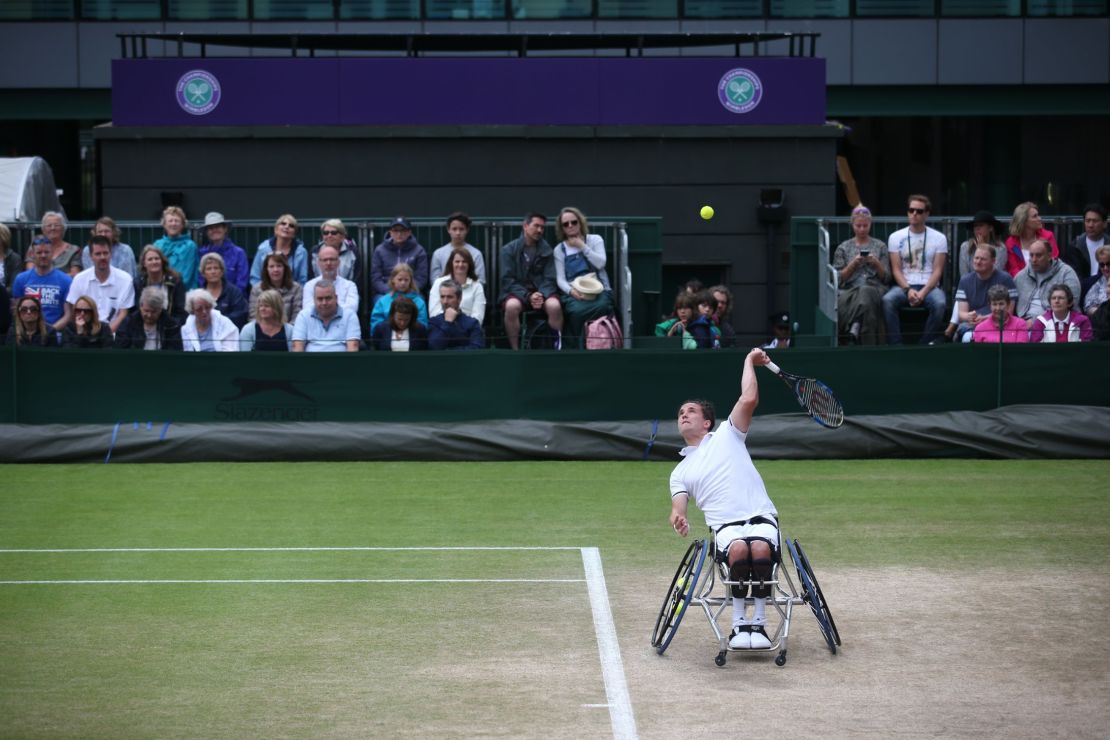 Reid serves against Swede Stefan Olsson during the Wimbledon men's wheelchair singles final.