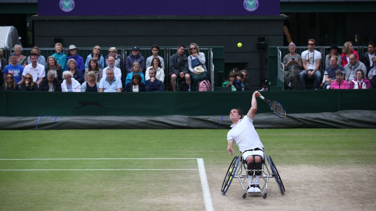 Reid serves against Swede Stefan Olsson during the Wimbledon men's wheelchair singles final.