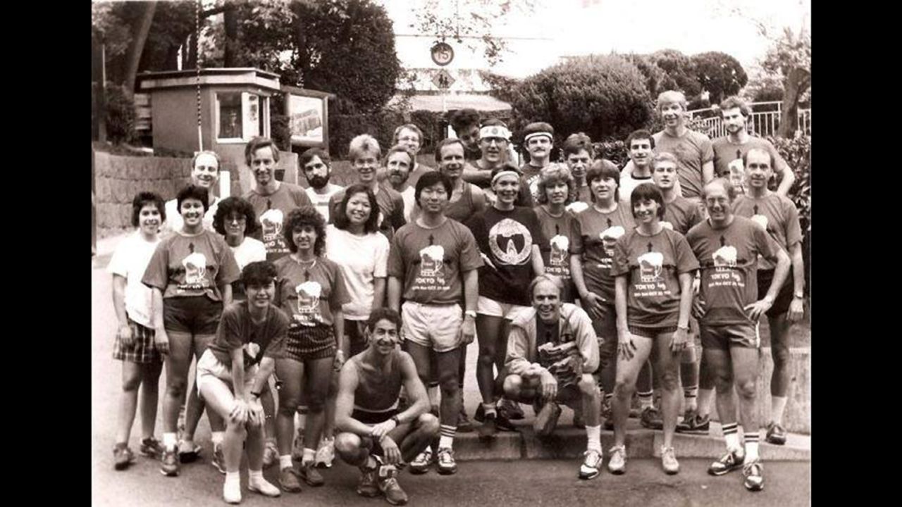 Peter Remsen's Hash club in Tokyo in the 1980s. He is wearing a jacket and squatting in front.