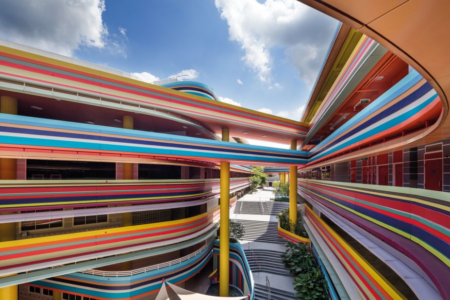 This eye-catching, colorful extension and rebuild of an existing primary school and kindergarten in Singapore was designed around a generous internal communal space. 