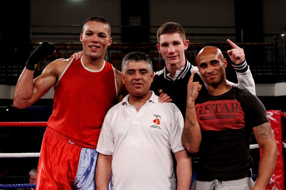 Khan (middle) is flanked by winning fighters Joe Joyce (L), Kirk Garvey (C) and Louis Adolphe (R) after a victorious night for Earlsfield at the 2012 ABA Elite Championship Finals at York Hall in east London. 