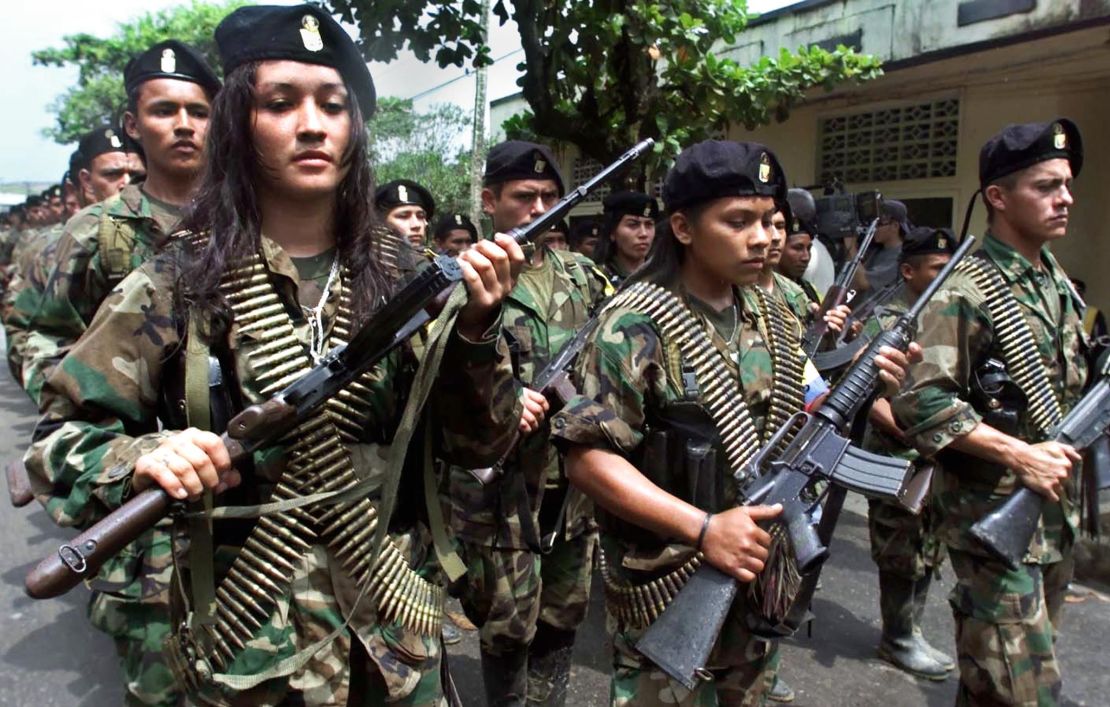 FARC guerrillas march in a military parade in San Vincente, Colombia, in 2001. 
