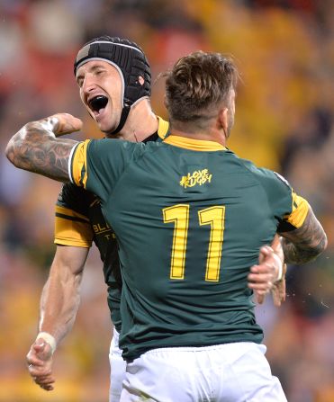 Johan Goosen of the Springboks celebrates with team mate Francois Hougaard after scoring a try during the Rugby Championship match between the Australian Wallabies and the South Africa Springboks at Suncorp Stadium on September 10, 2016 in Brisbane, Australia. 
